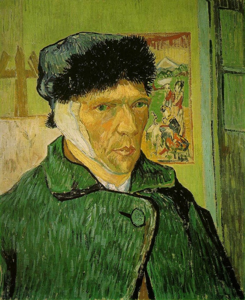 A self-portrait by the painter Vincent Van Gogh, showing himself with a bandaged ear. He is also wearing a hat with a fir trim and a heavy dark green coat, buttoned up at the top. Behind him there is a yellow wall with a Japanese print on it.